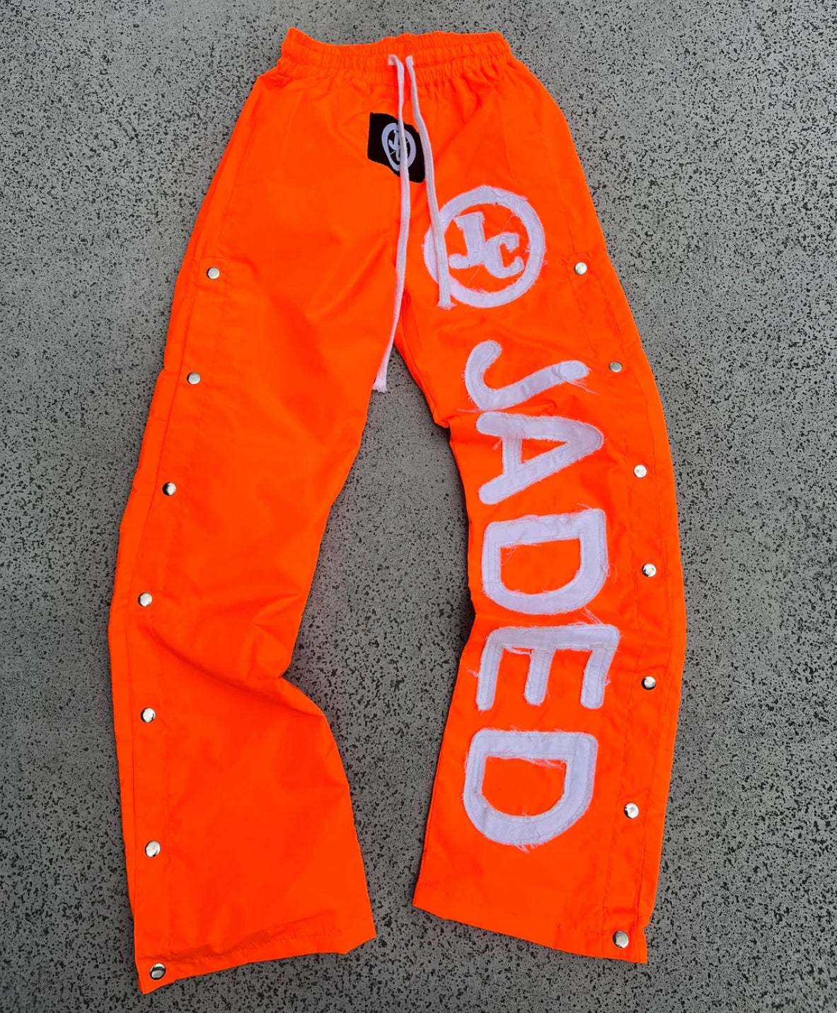 JADED WINDBREAKER PANTS “ORANGE”