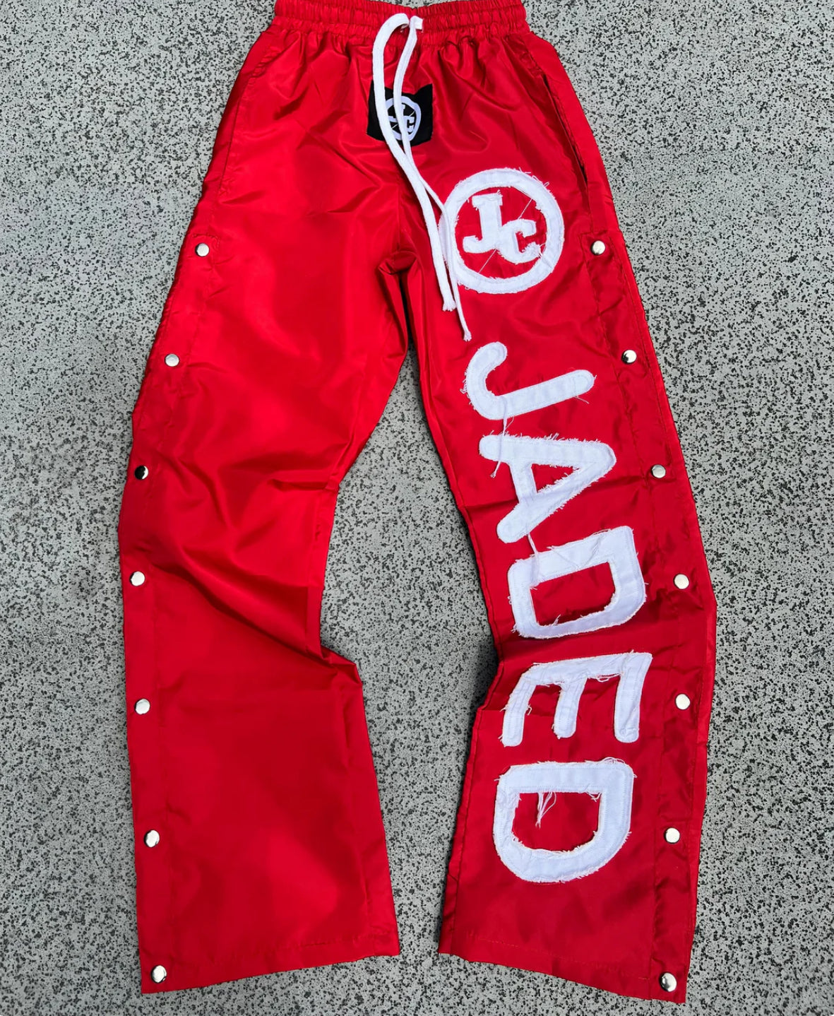 JADED WINDBREAKER PANTS “RED”